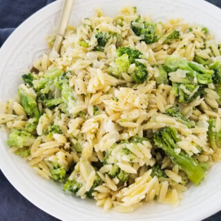 orzo with broccoli in white bowl