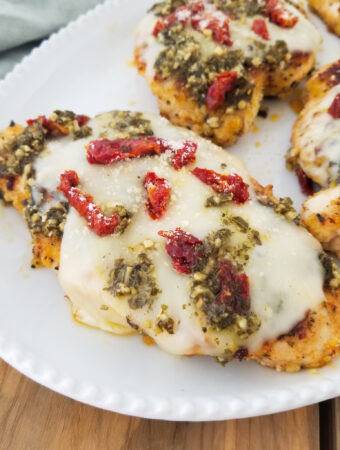 pesto chicken parmesan with sun dried tomatoes
