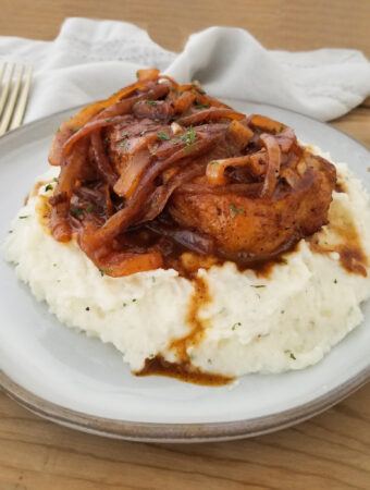 french onion pork chops on mashed potatoes