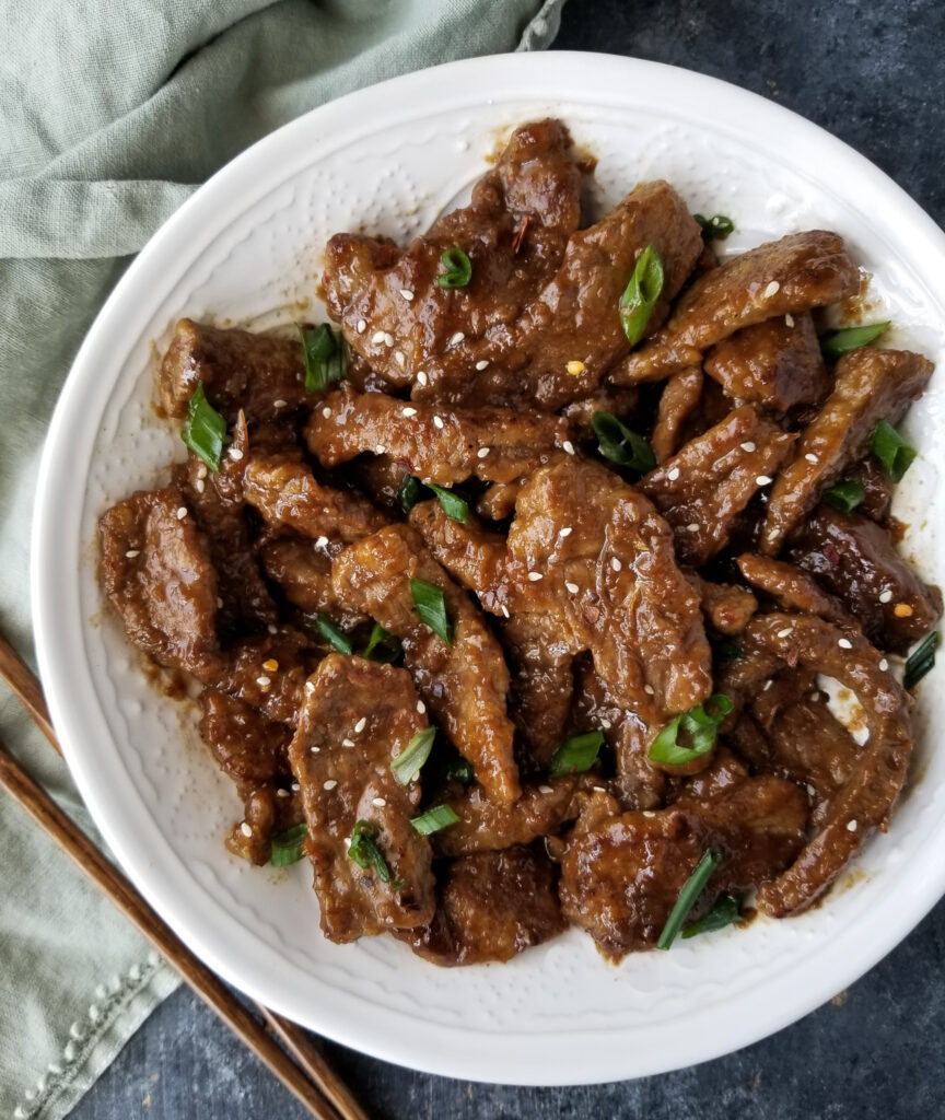 mongolian beef in white bowl