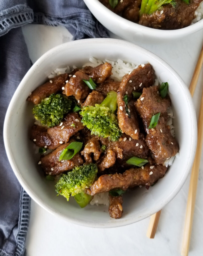 mongolian beef and broccoli in white bowl