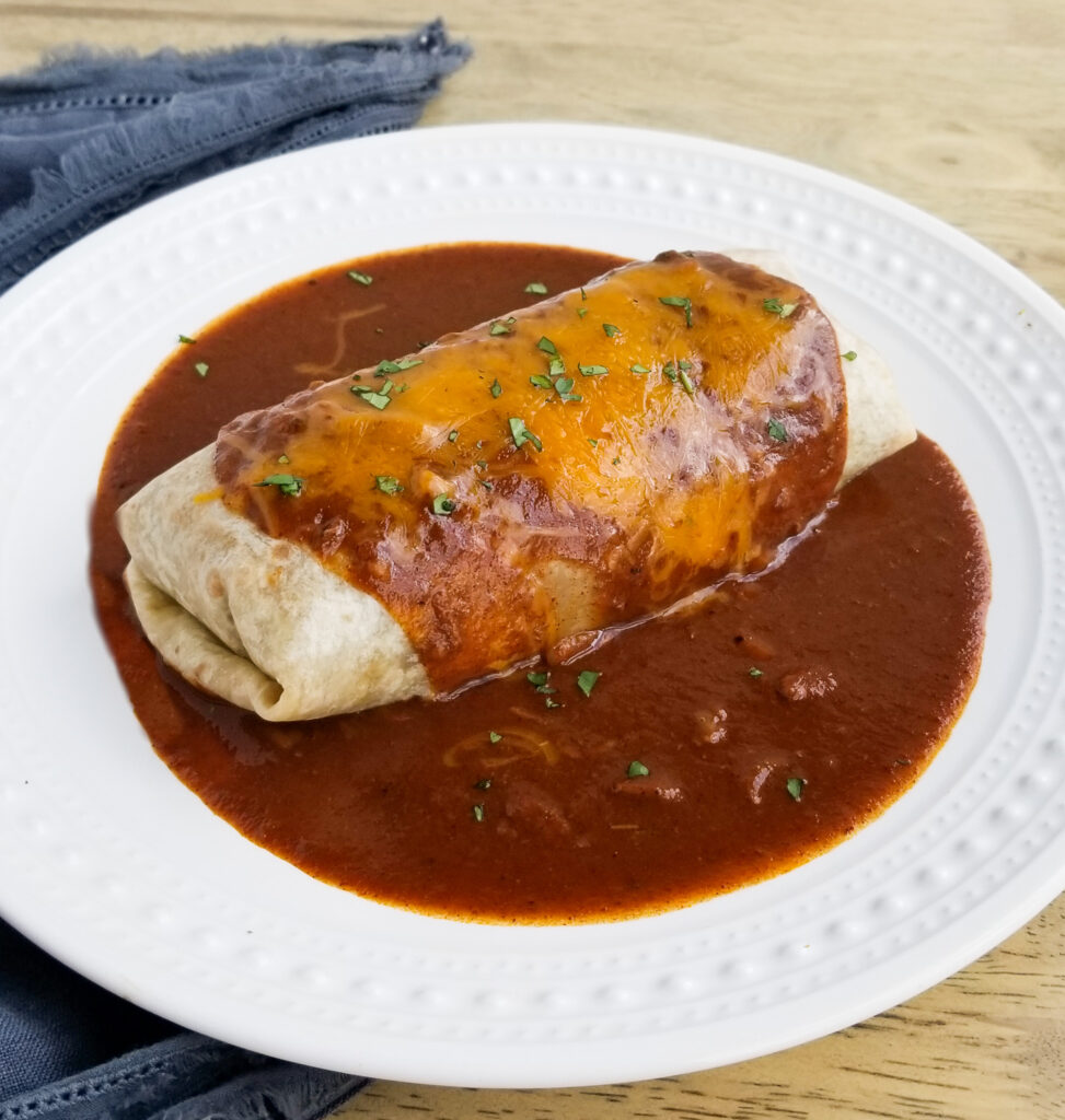 beef and bean burrito on plate
